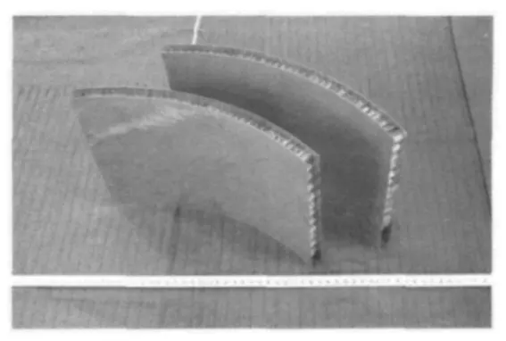 Fig. 7 Curve shaped honeycomb sandwich plate fabricatedby Ti alloy TC4