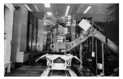 Figure 13 Robotic Machining Center Figure 13 Robotic Machining Center