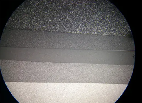 Fig. 1 Micro morphology of the same mold steel after different surface treatments (surface roughness decreases and gloss increases progressively from top to bottom)