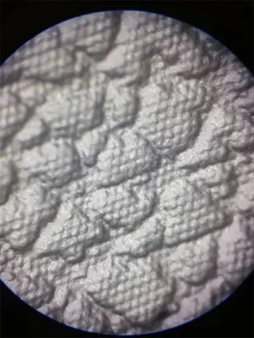 Figure 2 Micro morphology of the texture after micro etching treatment (fine secondary relief structures superimposed on a large scale base texture)